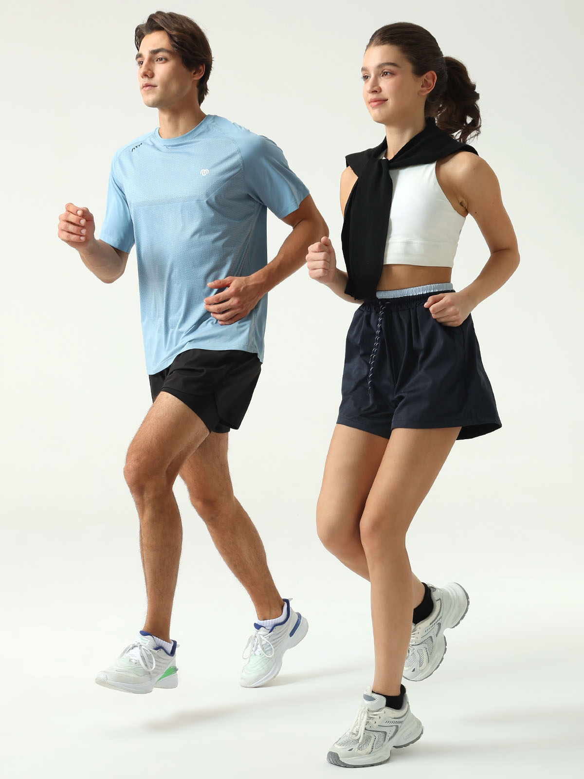 Men's black cushioned ankle running socks on male feet