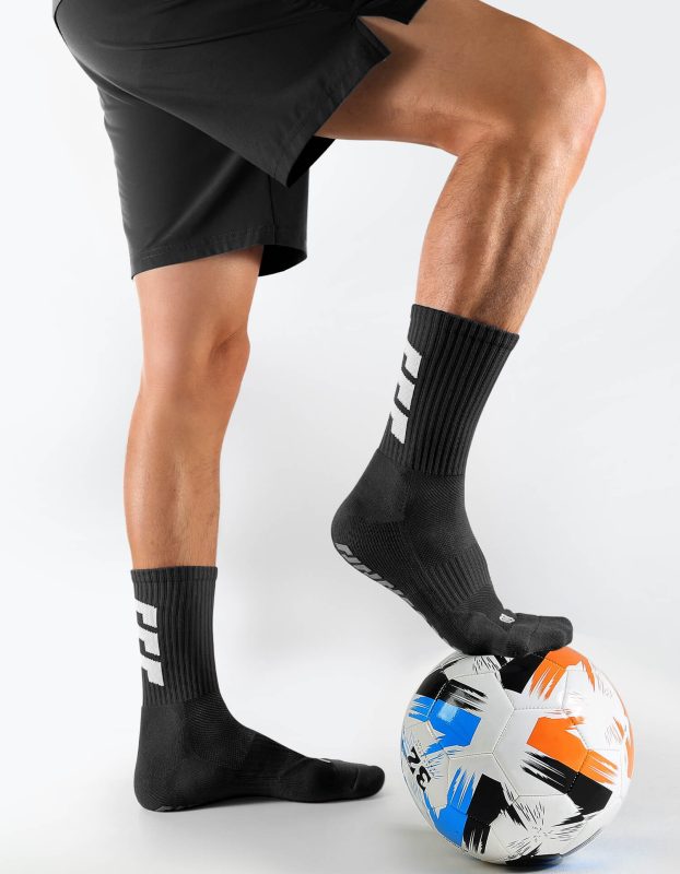 Black unisex soccer mid-calf socks with strong rubber grip sole and arch support