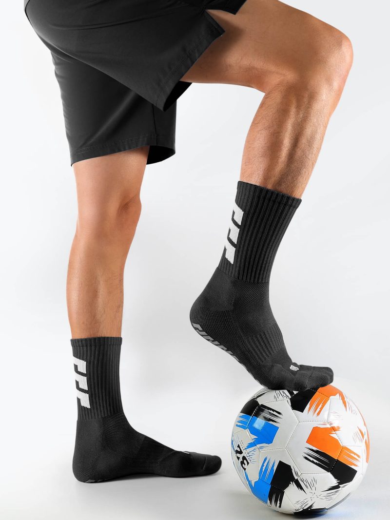 Black unisex soccer mid-calf socks with strong rubber grip sole and arch support