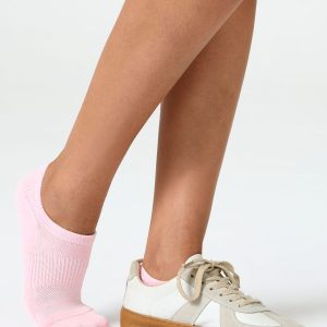 A detailed close-up product photograph of Closemate's pink ribbed cotton no-show invisible boat socks, set against a smooth, neutral beige background. The image clearly highlights the breathable fabric texture, the precise contoured fit around the foot, and the intricate patterned weave on the footbed designed for comfort.